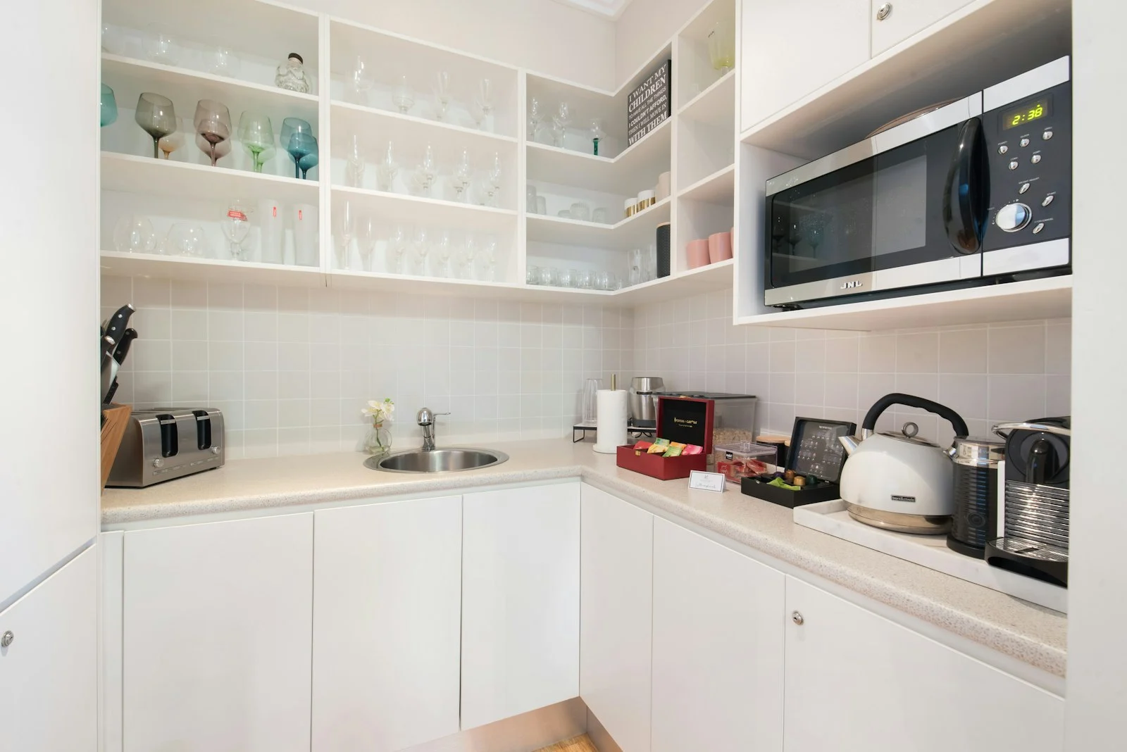 [PLACEHOLDER — client project photo] Custom pantry with glass fronts